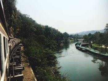 Bridge over river against sky