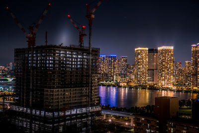 Illuminated buildings in city at night