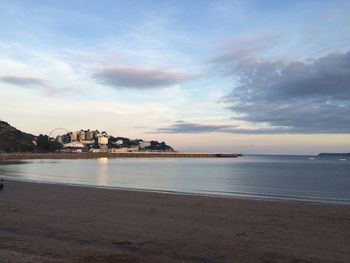 Scenic view of beach against city