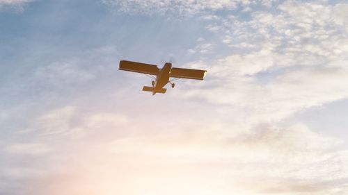 Low angle view of airplane against sky