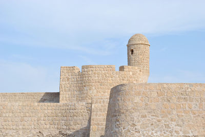 Low angle view of old building against sky