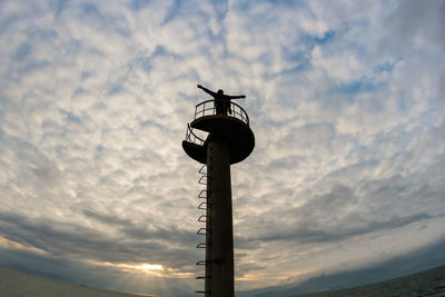 Low angle view of cloudy sky at sunset