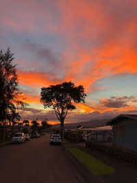 Car on road against sky during sunset