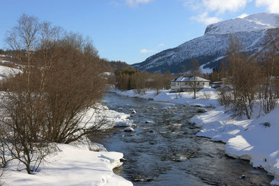 Scenic view of snow covered mountains against sky