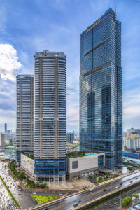 Modern buildings in city against sky