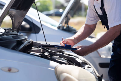 Close-up of man driving car