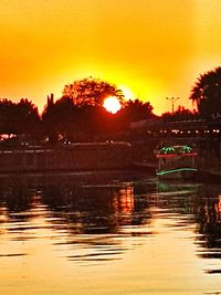 Scenic view of lake against sky at sunset