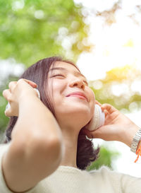 Close-up portrait of a smiling young woman