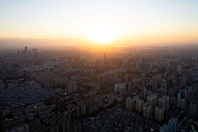 High angle view of townscape against sky during sunset