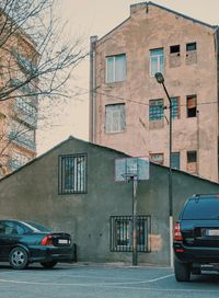 Cars on road by buildings in city