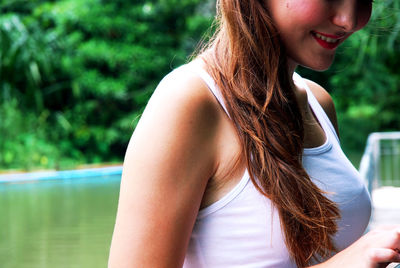 Midsection of woman wearing tank top