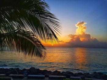 Scenic view of sea against sky at sunset