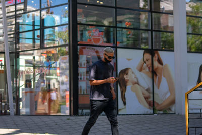 People standing in glass building