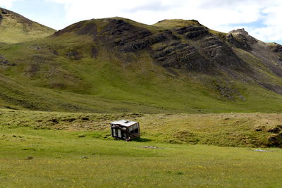 Scenic view of field against mountain