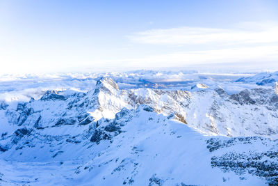 Scenic view of snowcapped mountains against sky