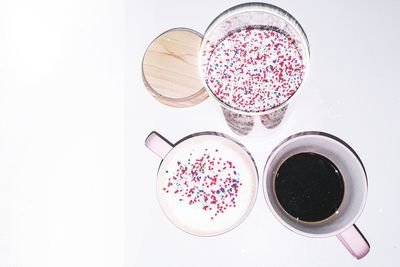 High angle view of coffee on table against white background