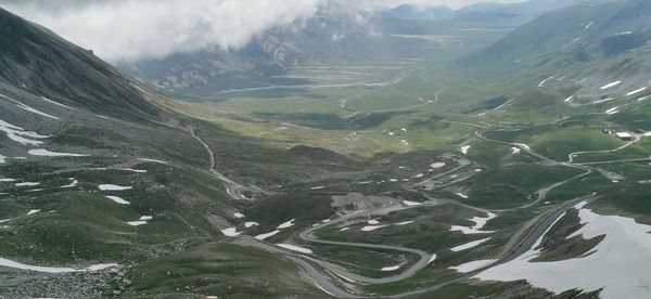 Aerial view of valley against sky