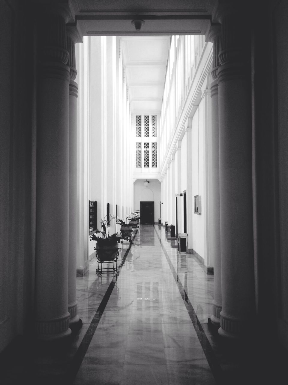 indoors, corridor, architecture, the way forward, empty, built structure, absence, door, window, narrow, diminishing perspective, in a row, ceiling, interior, flooring, building, architectural column, no people, column, day