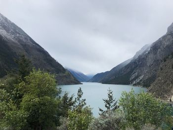 Scenic view of lake and mountains against sky