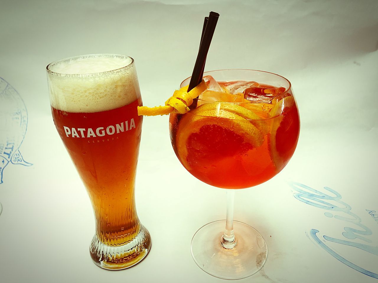 drink, food and drink, refreshment, glass, drinking glass, alcohol, food, household equipment, cocktail, table, indoors, still life, close-up, no people, freshness, glass - material, straw, transparent, drinking straw, orange color