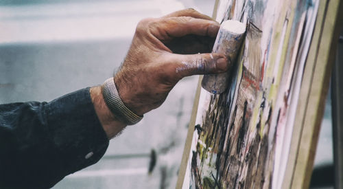 Cropped image of person holding camera