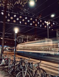 View of illuminated railroad tracks at night