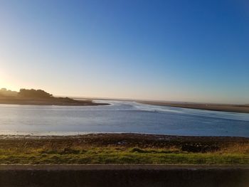 Scenic view of sea against clear blue sky