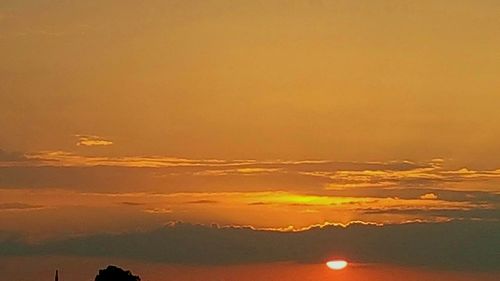 Scenic view of silhouette landscape against romantic sky at sunset