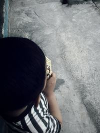 Rear view of boy standing