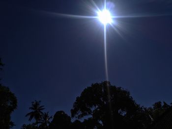 Low angle view of silhouette trees against clear sky