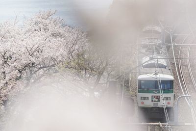 Train on snow covered landscape during winter