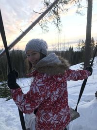 Woman standing on field during winter