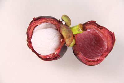 Close-up of strawberry over white background