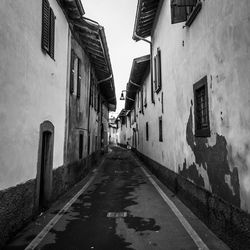 Narrow street amidst buildings in town