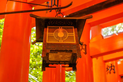 Close-up of illuminated lantern hanging in temple