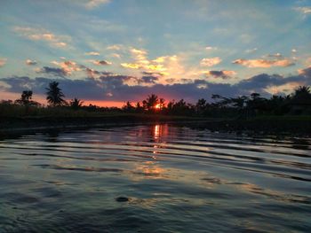 Scenic view of lake against sky during sunset