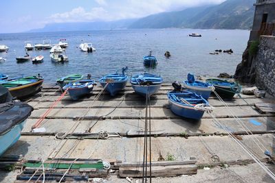 High angle view of boats moored on sea against sky