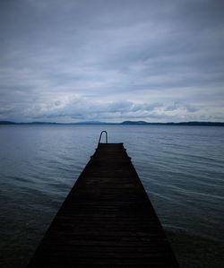 Pier over sea against sky