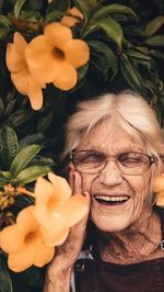 Portrait of woman with red flowers