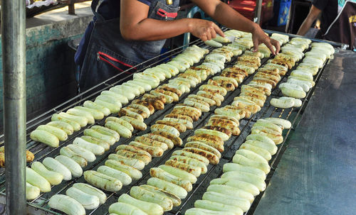 Midsection of man preparing food