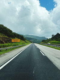 Empty road against sky