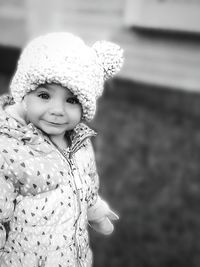 Portrait of cute girl standing outdoors