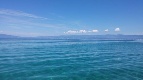 Scenic view of sea against blue sky