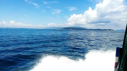 Scenic view of sea against cloudy sky