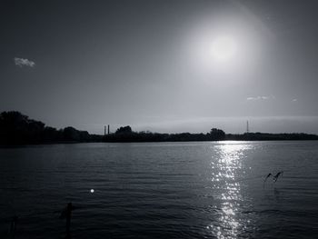 Scenic view of lake at sunset