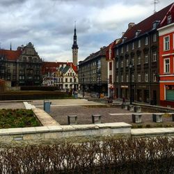 Buildings in town against sky