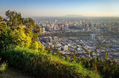 High angle view of trees and buildings against sky