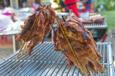 Close-up of meat on barbecue grill