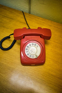 Close-up of telephone booth on table