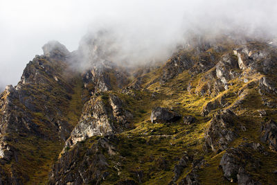 Scenic view of mountains during foggy weather